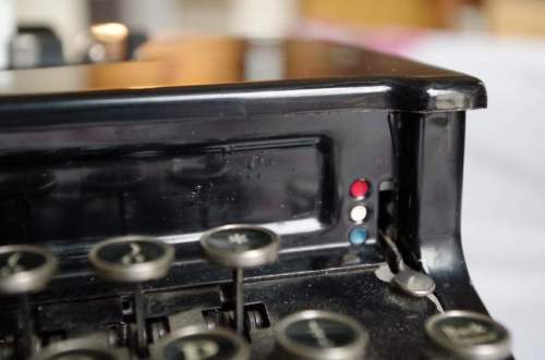 Naturally it should have a red/black ribbon, no?