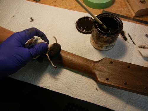 staining the neck with a pad and dark walnut gel stain
