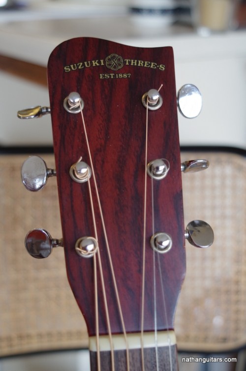 headstock logo with Suzuki Three S label