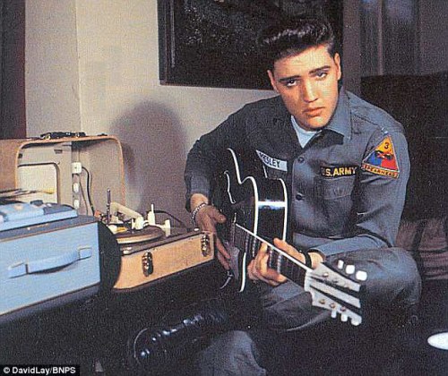 Elvis with his phonograph/amplifier